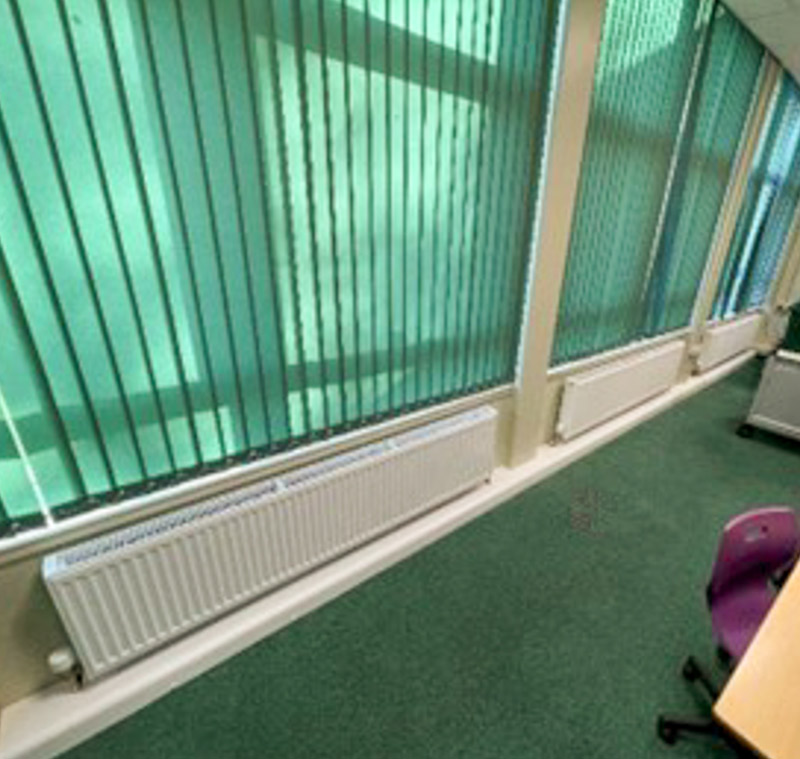 New panel radiators as part of an upgraded heating system, providing more efficient and cost-effective heating