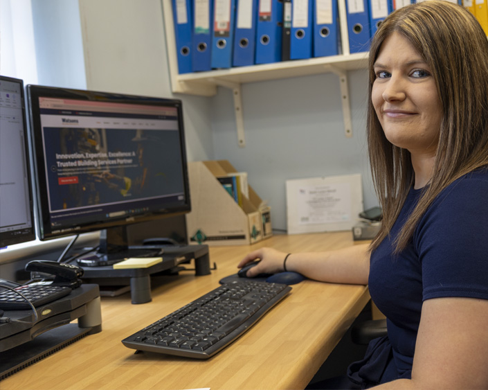 Sarah working at her desk in WBS